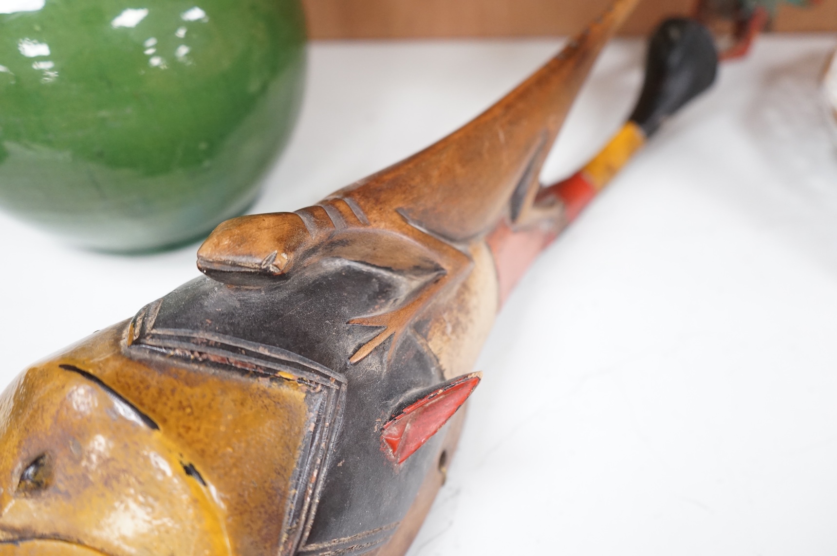 An early 20th century Tribal carved and painted mask from the Ivory Coast, 74cm in length